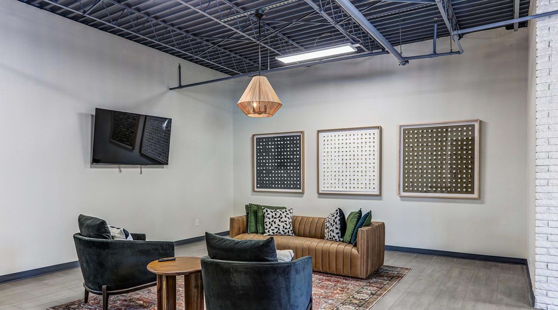 Modern resident clubroom at Dalton Station, a studio apartment community near Dalton Mall.