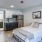 a bedroom with a bed and a table